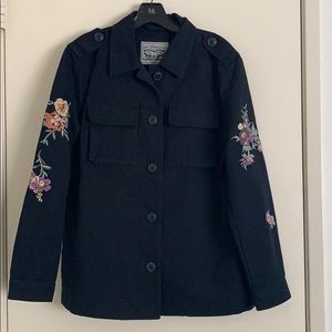 Levi’s black denim jacket with embroidered flowers